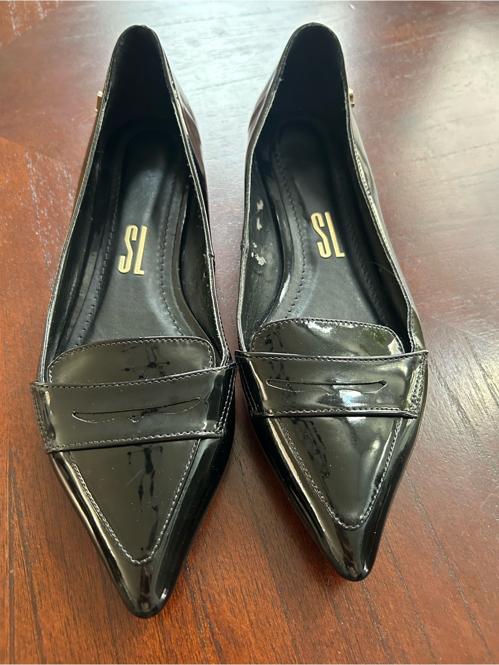 Pointed Toe Black Patent Loafer Flats size 8B It shows wear on the inside.